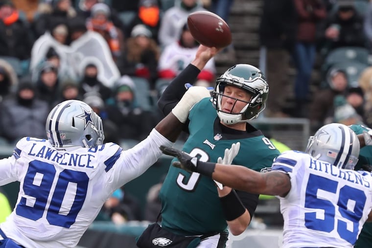 Nick Foles enters the playoffs after two uninspiring performances. MICHAEL BRYANT/ Staff Photographer