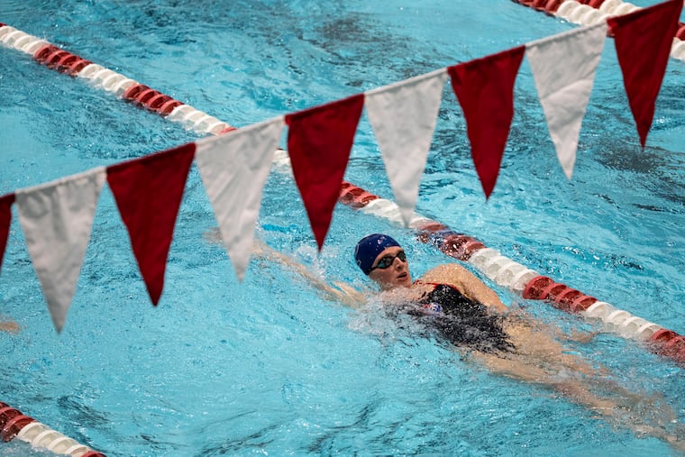 Penn swimmer Lia Thomas warms up with her team before a meet against Harvard at the Blodgett Pool on Jan. 22.