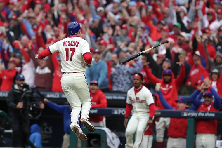 Rhys Hoskins celebrated after hitting a home run against the Padres in the clinching NLCS Game 5 played in the rain on Oct. 23. Rain is possible for Game 3 of the World Series on Monday.