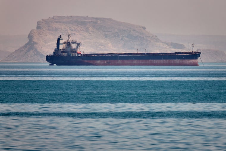 A bulk cargo ship sits at anchor in the Strait of Hormuz off Bandar Abbas, Iran, Saturday, May 2, 2026.