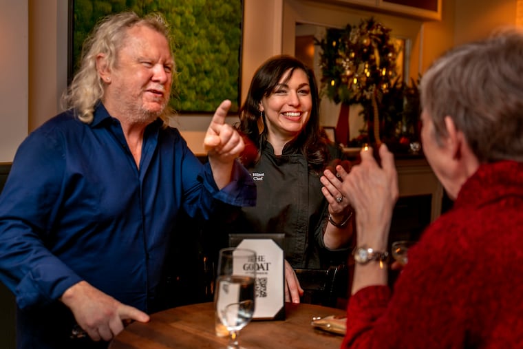 Co-owner Fergus "Fergie" Carey (left) and chef Mackenzie Hilton (right) talk with patrons at the Goat Rittenhouse, Dec. 7, 2021, a new low-key but comfortable neighborhood bar for Rittenhouse Square.