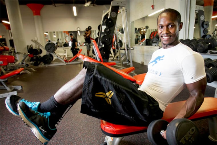 Robert Jones, III, at East Falls Gym Fitness where he trains on Friday morning August 2, 2013. He is doing and angled bicep curl. (Alejandro A. Alvarez / Staff Photographer)