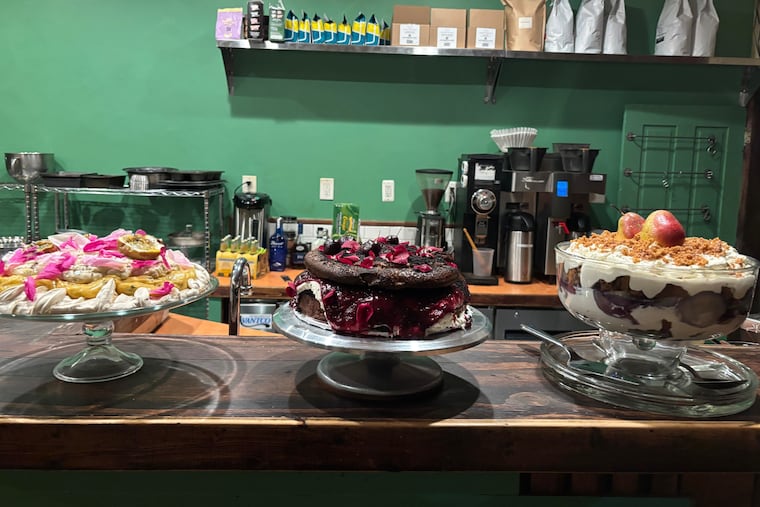 The desserts at the beginning of Dreamworld Bakes' housewarming party: passionfruit pavlova, Black Forest gateau, and gingerbread trifle.