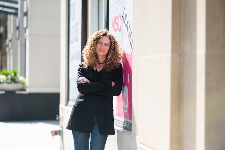 Ellen Shepp, owner of Joan Shepp, a luxury clothing store in Center City, poses for a portrait outside a new location of the store in front of Rittenhouse Square on Walnut Street on Monday, May 19, 2025. Shepp says the new location is set to open this September.