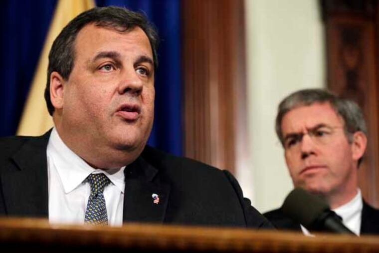 New Jersey Attorney General Jeffrey S. Chiesa, right, listens as Gov. Chris Christie answers a question Thursday, Jan.17, 2013, in Trenton, N.J. Christie discussed efforts to reduce gun violence including mental health, addiction and overall violence in society. The governor also referred to the NRA's ad referencing President Obama's children as "reprehensible." (AP Photo/Mel Evans)