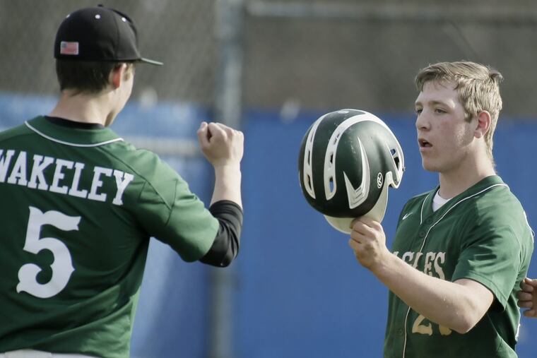 Dylan Wakeley (left) congratulates Mike Gismondi during the Eagles’ 6-3 victory over Sterling on Thursday.