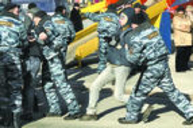 Police detain protesters during a rallyin Vladivostok. Though the rallies started over car fees, they now reflect general discontent.
