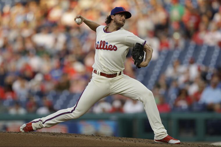 Aaron Nola pitches against the Rockies. He struck out 10 in 6 2/3 innings.