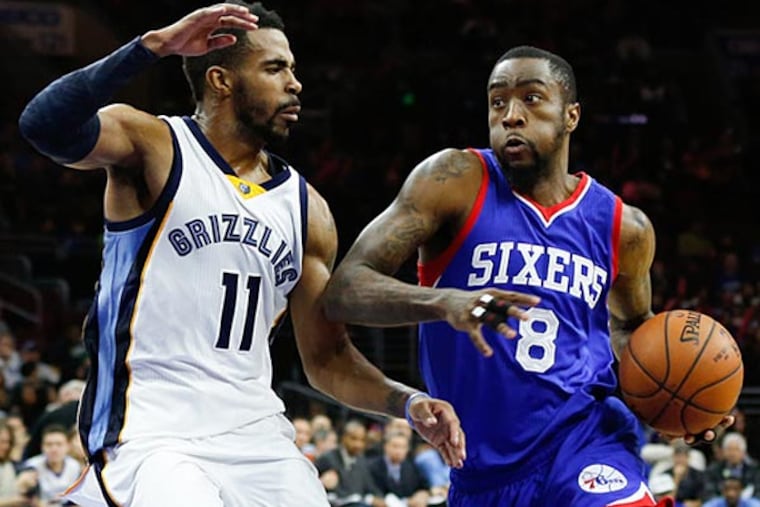 Philadelphia 76ers guard Tony Wroten (8) drives past Memphis Grizzlies guard Mike Conley (11) during the second half at Wells Fargo Center. The Grizzlies defeated the 76ers 120-115. (Bill Streicher/USA Today)