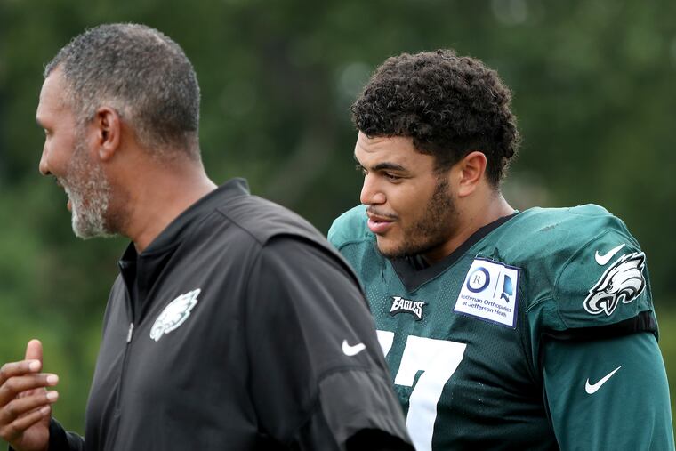 Eagles offensive tackle Andre Dillard, right, walks off after Eagles training camp Tuesday.