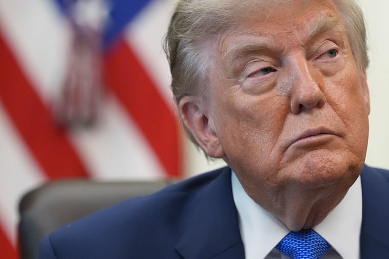 President Donald Trump listens during a meeting Monday. He has pivoted in recent days to an economic strategy to end the war in Iran.
