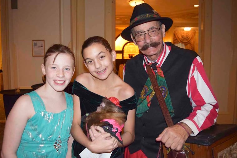 Partyers (from left) Audrey Medick, Samantha Woolworth, Joe Bush, and Sash the monkey. For the Inquirer/Maggie Henry Corcoran