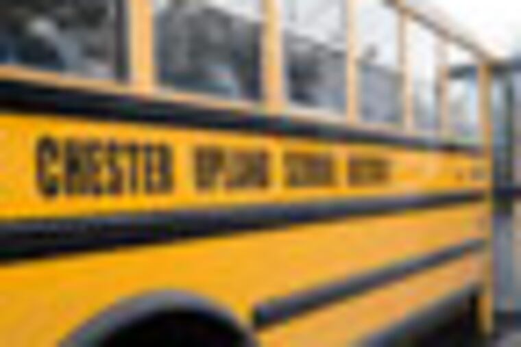 Students hop on a bus outside Chester High after classes were dismissed for the day. (Clem Murray / Staff Photographer) EDITORS NOTE: RRXChester12-k 1/11/2012 Dan visits Chester Upland schools to talk to parents, students and teacher about their hopes and fears now that the district if flat broke. 11 of 17