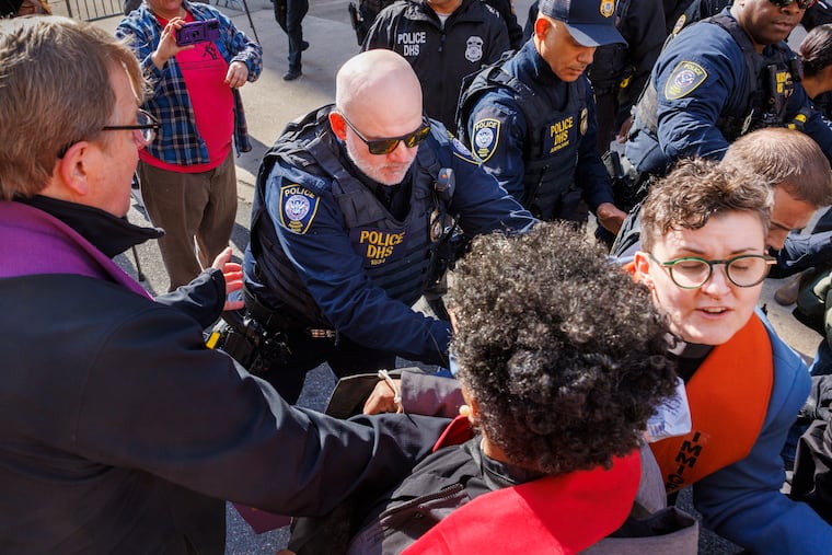 Philadelphia has been the site of repeated protests against ICE, and sometimes against city officials who activists say must do more to protect undocumented residents. Here an officer with U.S Department of Homeland Security moves a member of the clergy during a No ICE Philly protestor outside the Immigration and Customs Enforcement in March.