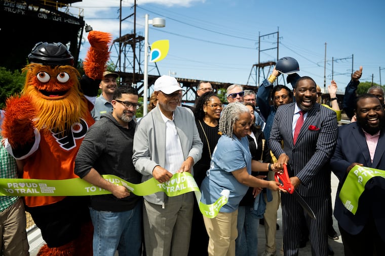 City officials and Gritty celebrate the opening of the new southern section of the Schuylkill River Trail with a ribbon cutting on Saturday, May 17, 2025.