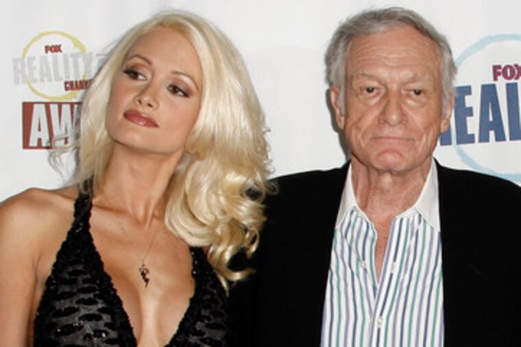 Hugh Hefner , with erstwhile gf Holly Madison, informs that reinforcements have arrived.
