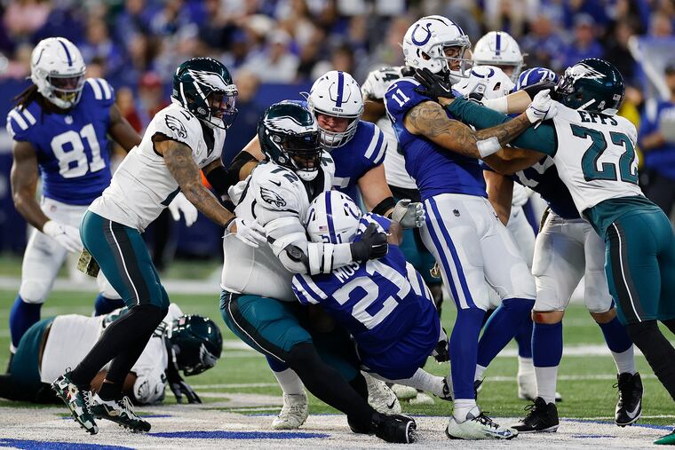 Eagles defensive tackle Linval Joseph stops Indianapolis Colts running back Zack Moss in the third quarter on Sunday in Indianapolis.