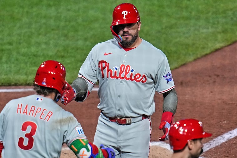 Kyle Schwarber (right) and Bryce Harper (3) played key roles in the Phillies' comeback victory on Friday.