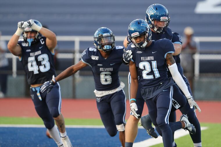 Villanova players celebrate after Elijah Trent (21) returned an interception for a touchdown against Lehigh during the 2nd quarter on Sept. 7, 2019.