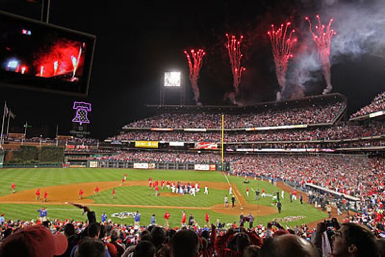 Fans celebrated after Roy Halladay no-hit the Phillies in Game 1 of the NLDS. (David M Warren/Staff Photographer)