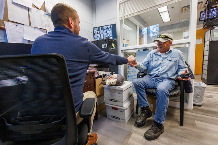 John Weis, Life Center of Delaware County's lead case manager (left), assists client Joseph Wallace.