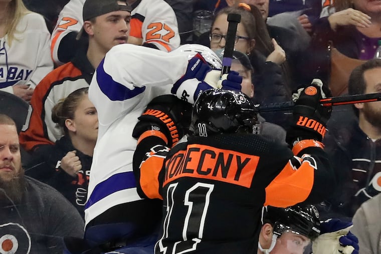 Travis Konecny is opening eyes with his all-around game, which is a big reason he's headed to his first All-Star Game. Here he is shoving Tampa Bay defenseman Victor Hedman as teammate Travis Sanheim ducks for cover.