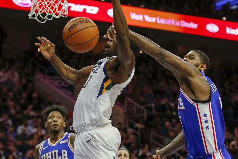 Sixers forward Amir Johnson blocks a shot by Jazz center Ekpe Udoh during the second quarter Monday night.