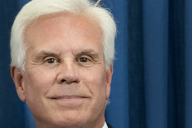 South Jersey power broker George E. Norcross III looks on as his lawyers speak to reporters at the Richard J. Hughes Justice Complex in Trenton after his indictment on racketeering charges Monday.