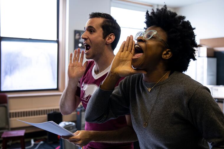 Sean Close (left) and Brett Robinson in rehearsal at the Our Lady of Mount Carmel School for 1812 Productions' "This Is the Week That Is."