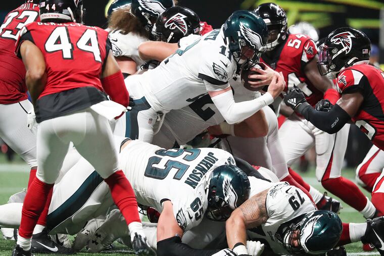 Eagles quarterback Carson Wentz scores a foruth-qarrter touchdown against the Atlanta Falcons Sunday night.