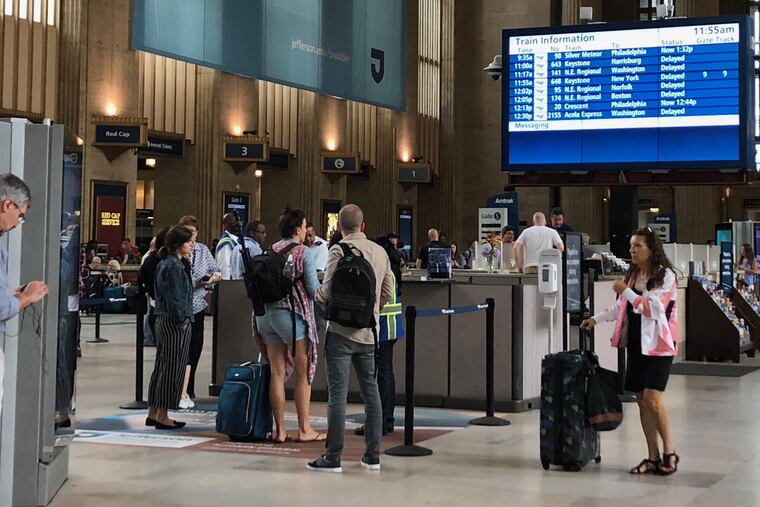 Passengers stuck at 30th Street Station after power line problems on the Northeast Corridor halted rail service between Philadelphia and New York on Wednesday, June 19, 2019.