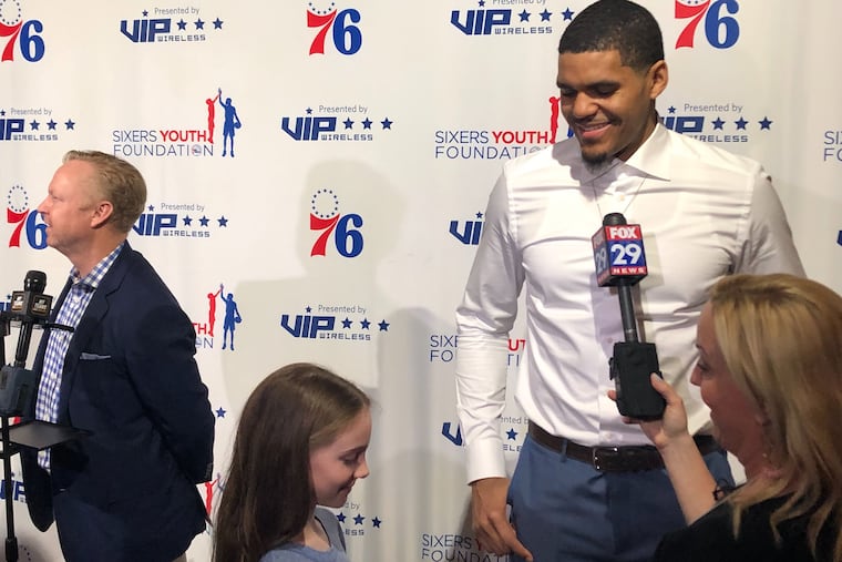 Tobias Harris talks to a young fan at the Sixers Youth Foundation Gala on Monday at the Fillmore in Fishtown.
