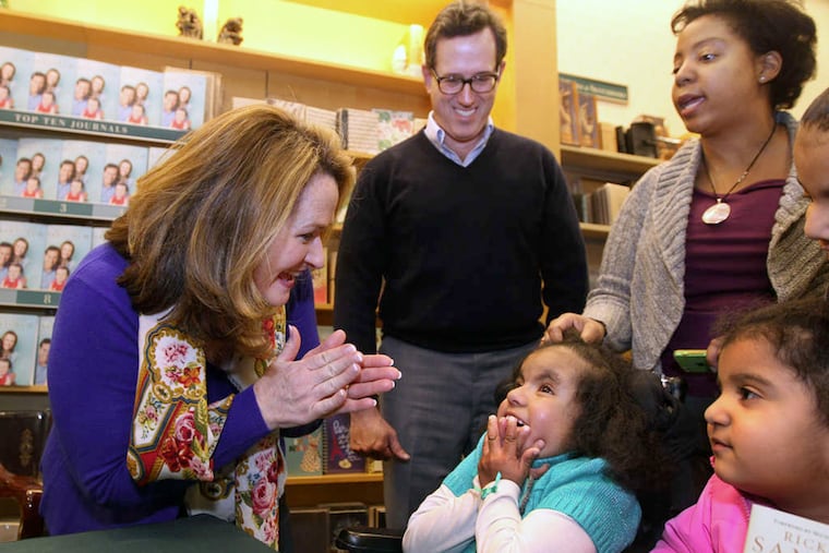 Karen and Rick Santorum visit with Alyssa Shihadeh and her mother, Trish, at the Barnes & Noble in Exton. Alyssa has the same medical condition as the Santorums' daughter Bella.