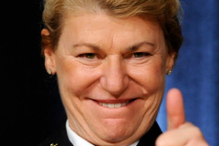 Gen. Ann E. Dunwoody gestures to her father, retired Brig. Gen. Hal Dunwoody, 89.