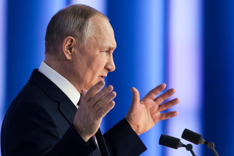 Russian President Vladimir Putin gestures as he gives his annual state of the nation address in Moscow, Russia, on Tuesday.