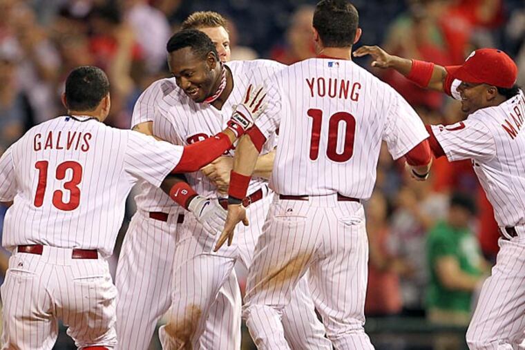 Phillies' Domonic Brown celebrates his game RBI single with this
teammates during the bottom of the ninth-inning against the Washington
Nationals played on Monday, June 17, 2013. (Yong Kim/Staff
Photographer)