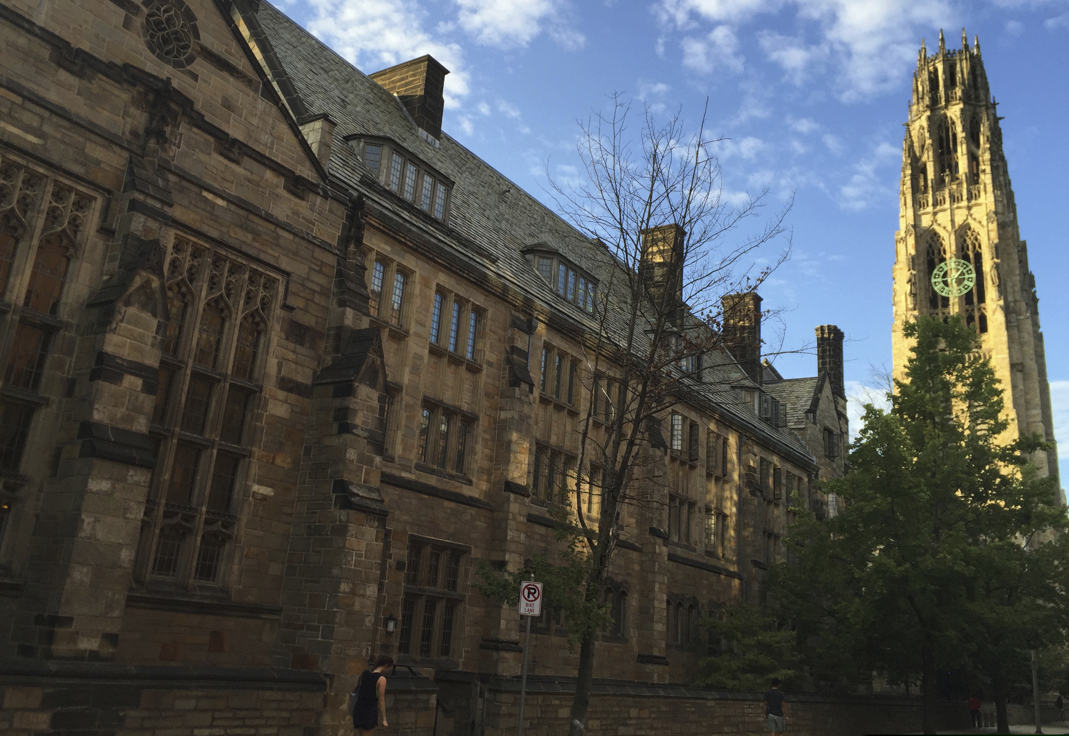 FILE - This Sept. 9, 2016 photo shows Harkness Tower on the campus of Yale University in New Haven, Conn. Dozens of people were charged Tuesday, March 12, 2019, in a scheme in which wealthy parents allegedly bribed college coaches and other insiders to get their children into some of the nation's most elite schools. (AP Photo/Beth J. Harpaz, File)