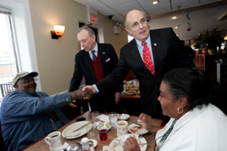 Campaigning for John McCain , former New York City Mayor Rudy Giuliani (right) and Sen. Arlen Specter(R., Pa.) greet Alfonso Maxwell and Carol Smith at the Penrose Diner in South Philadelphia.