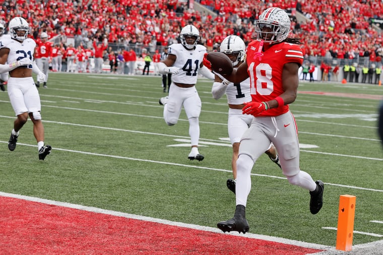 Ohio State receiver Marvin Harrison scores a touchdown against Penn State during the second half of an NCAA college football game Saturday, Oct. 21, 2023, in Columbus, Ohio.