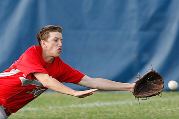 Lenape's John Eigenbrood dives for a foul ball. (Ron Cortes / Staff Photographer)
