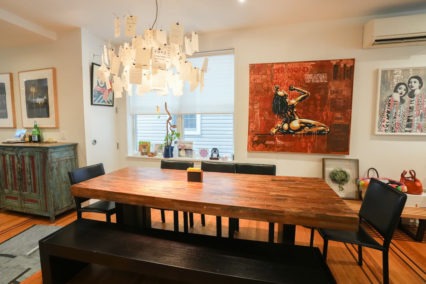 Suntaranon's dining room seats eight and is lit by Zettel’z chandeliers designed by German industrial designer Ingo Maurer.