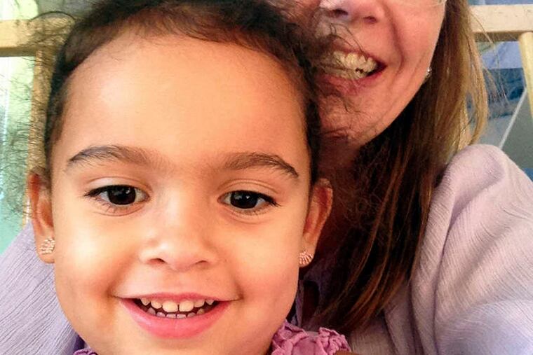 Veronica, 4, with Melanie Capobianco recently, left, and with her biological father, Dusten Brown. The girl is returning with the Capobiancos to South Carolina from Oklahoma.