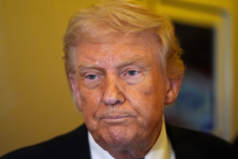 President Donald Trump speaks to reporters aboard Air Force One, Friday, May 15, 2026, as he returns from a trip to Beijing, China.