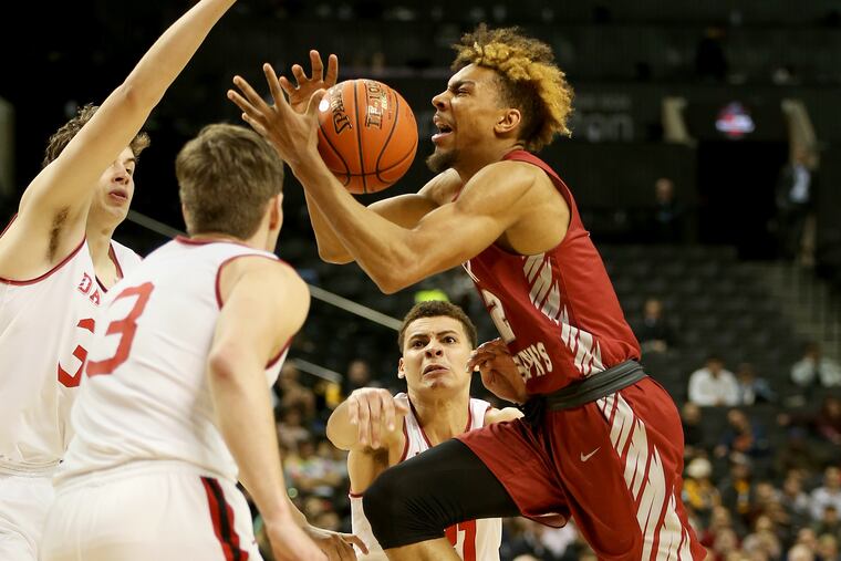 Charlie Brown (right), here in action against Davidson in March, worked out for the Sixers on Tuesday.