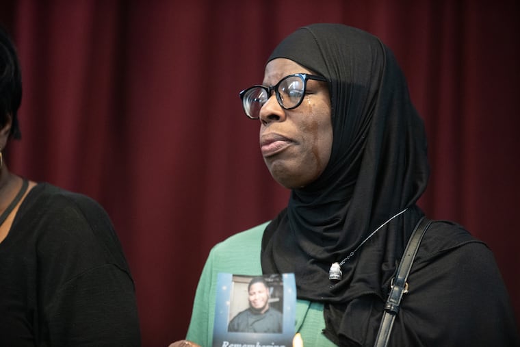 Amira Brown holds a photograph of her son Steven Dreuitt at a remembrance event on Saturday, Nov. 22, 2025, at Oxford Presbyterian Church in North Philadelphia. Dreuitt, 37, was killed along with his girlfriend Dominique Goods-Burke in the Jan. 31 plane crash in North Philadelphia. Brown's grandson, 10-year-old Ramesses Raziel Dreuitt Vazquez, was severely burned in the crash.
