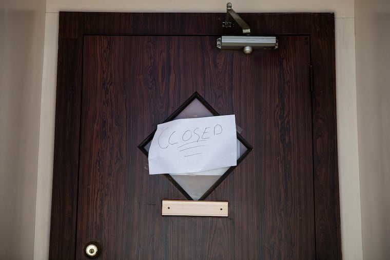 A closed sign is posted on a door at the Midtown III Restaurant & Cocktail Lounge in Philadelphia, Pa. on Thursday, April 30, 2020.