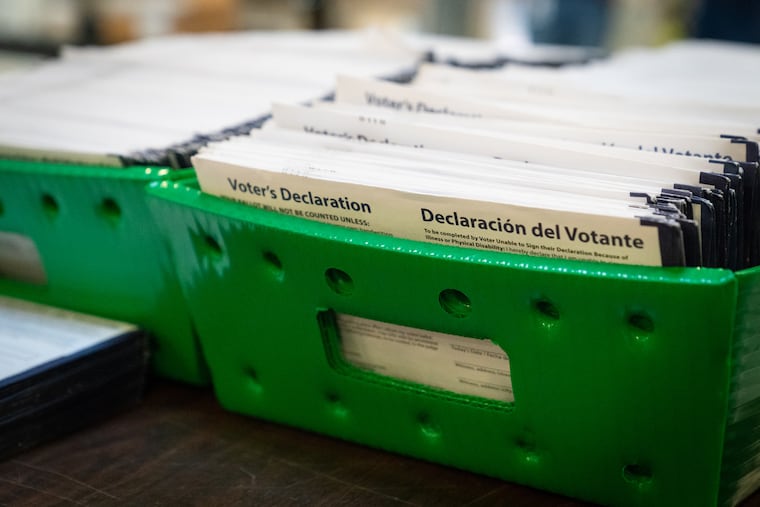 Philadelphia mail ballots are stacked in a bin.