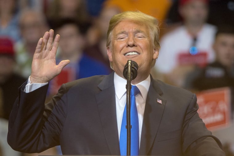 President Trump appears at a campaign rally for U.S. Rep. Lou Barletta at the Mohegan Sun Arena in Wilkes-Barre in August. GRALISH / Staff Photographer