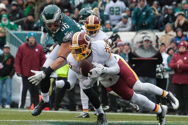 Redskins safety Deshazor Everett intercepts a pass intended for Zach Ertz in the endzone.