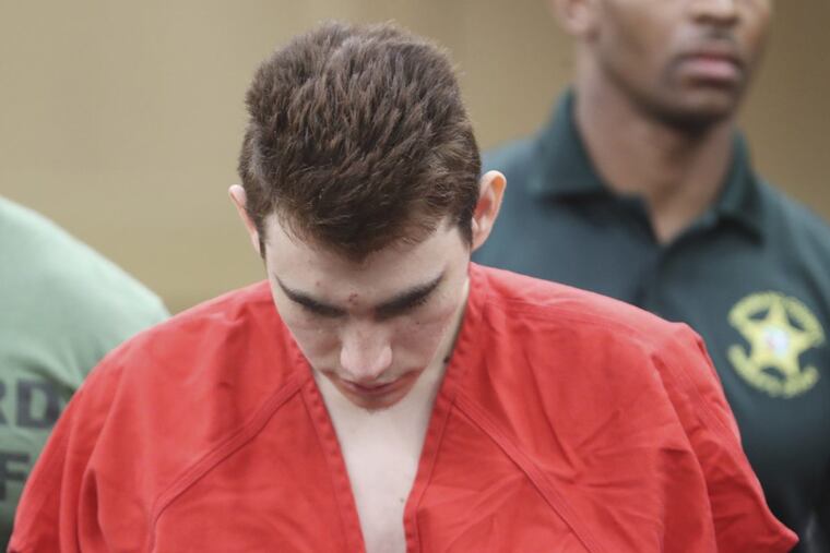 Accused school shooter Nikolas Cruz is led out of the courtroom after an arraignment hearing at the Broward County Courthouse in Fort Lauderdale, Fla., Wednesday, March 14, 2018.
